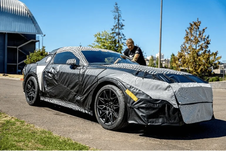 S650 Mustang Ford drops more covered S650 Mustang pics ahead of next week's reveal! 135978FA-3218-4954-98C4-7FACD18C8163