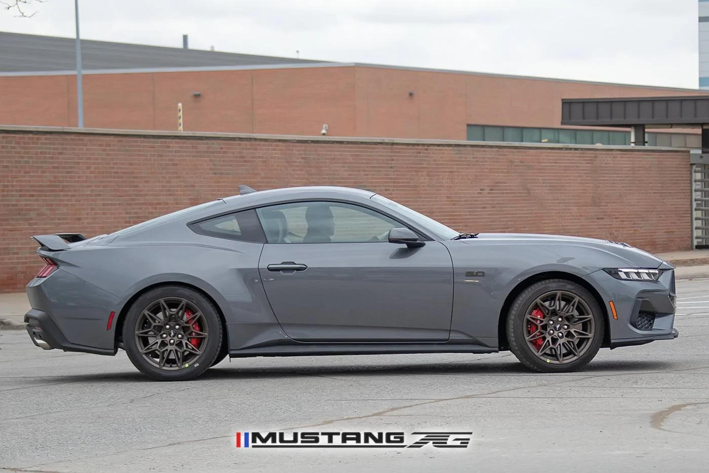 2024-mustang-gt-carbonized-gray-bronze-package-black-red-racing-stripes-11.jpg