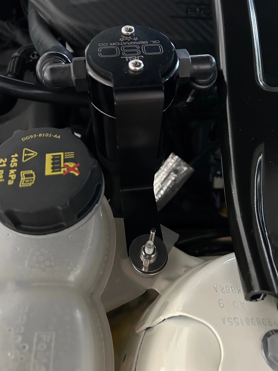 S650 Mustang Removing Oil Dipstick with Ford Performance Strut Tower Brace Above It. IMG_2536